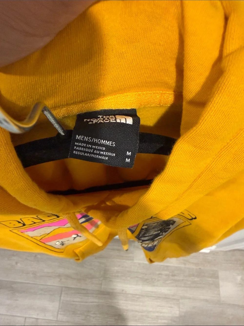 The North Face Baggin’ Peaks Graphic Hoodie Yellow Pullover Sweatshirt